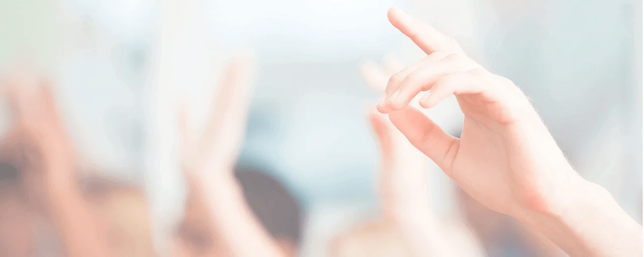 Raised hand in a crowd