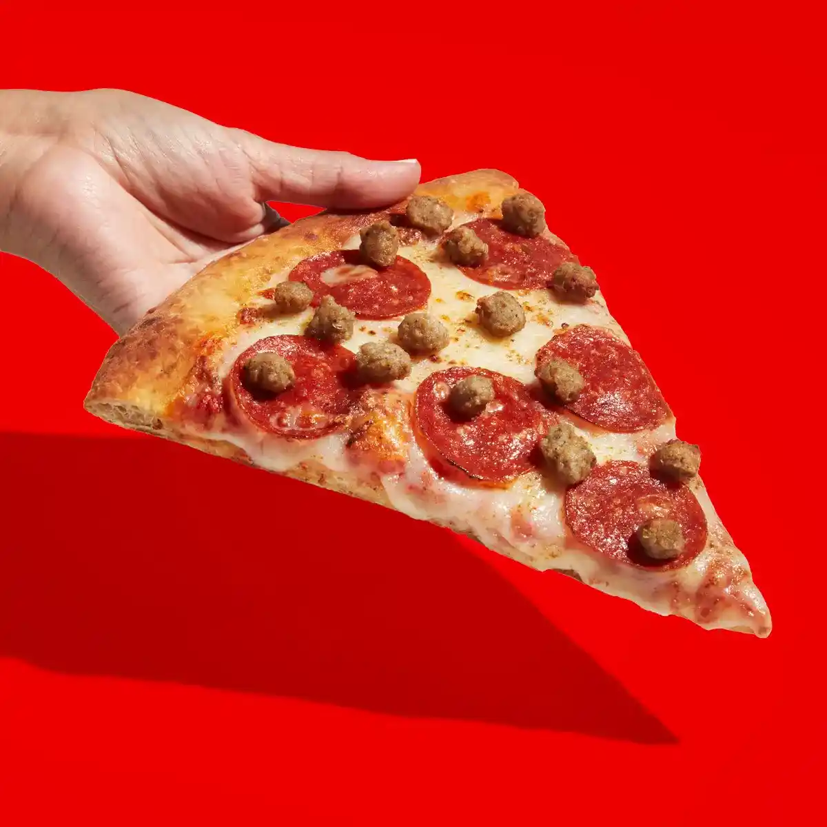 slice of sausage and pepperoni RaceTrac pizza